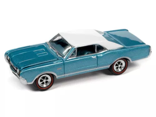 Teal die-cast model car with white racing stripe and chrome wheels, side angle
