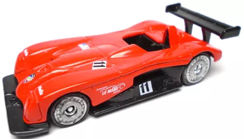 Red diecast race car with black side panels, number 11, open cockpit