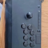 Arcade joystick control panel with lever and circular buttons, dark gray