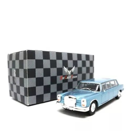 Light blue diecast limousine toy car with checkered display case, front three-quarter view