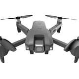 Gray foldable quadcopter drone with four propellers and front camera