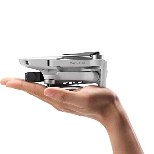 DJI Mavic Mini drone in hand, side view