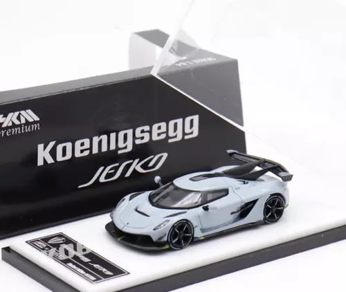 1:64 gray sports model diecast car, black wheels, on display base