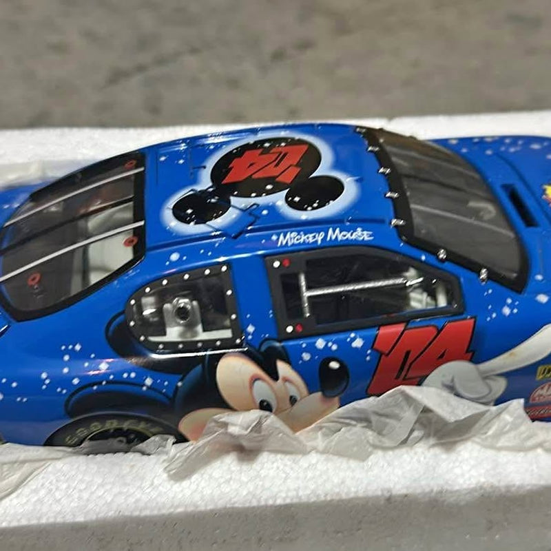 Blue diecast NASCAR race car with Mickey Mouse logo on hood and windshield