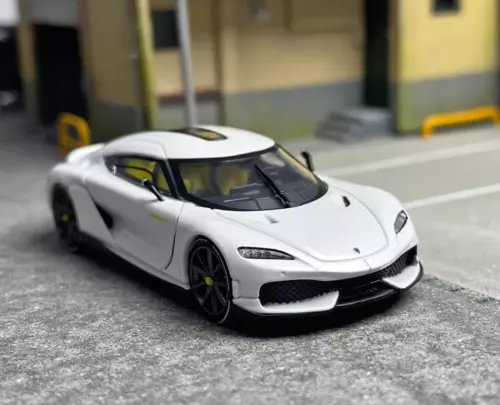 White 1:64 diecast metal sports car model with black grille and hood detail