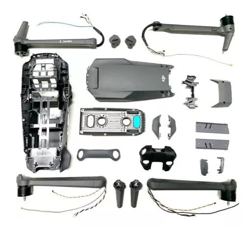 Disassembled drone parts set with body shell, arms, and motors
