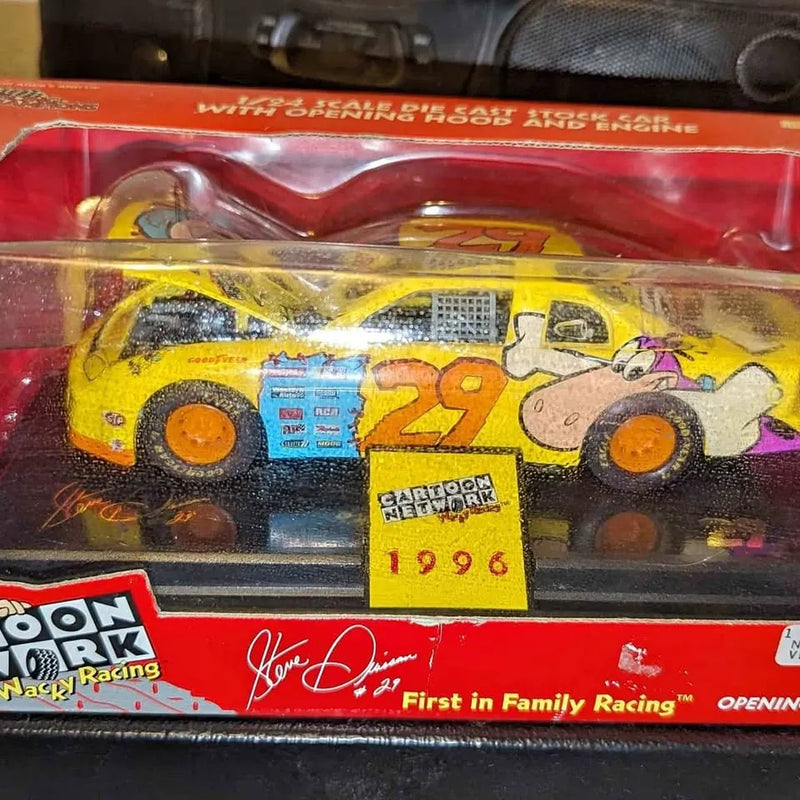 NASCAR diecast race car model with yellow body and orange wheels, #29 graphics