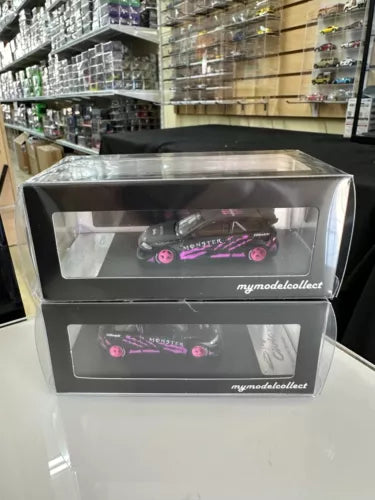 Pink and purple diecast car model in a clear display box