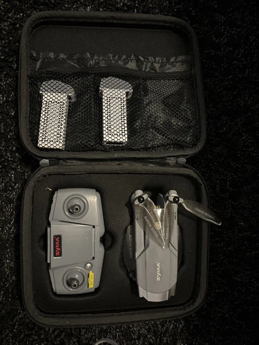 Syma X500Pro gray GPS drone with prop guards in hard case