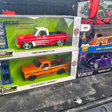 Die-cast Chevrolet C-10 truck model in box, red and white, chrome wheels