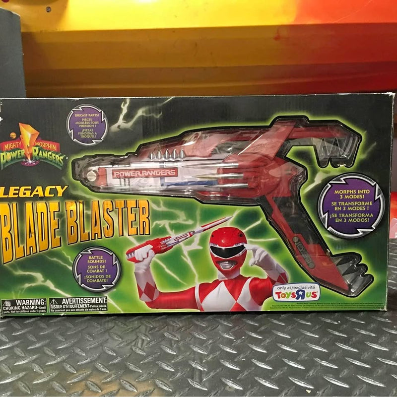 Boxed diecast Blade Blaster toy with red ranger figure on green packaging