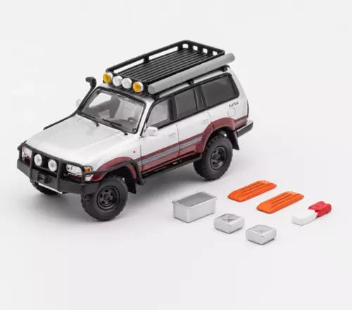 White and red diecast off-road SUV model with roof rack, black grille and front bumper.