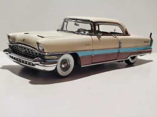 Danbury Mint 1956 Packard diecast model car, beige with blue stripe, front 3/4 view