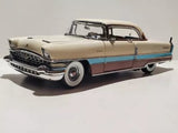 Danbury Mint 1956 Packard diecast model car, beige with blue stripe, front 3/4 view