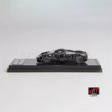 1:64 scale diecast model car, full carbon-look black, on black display base.