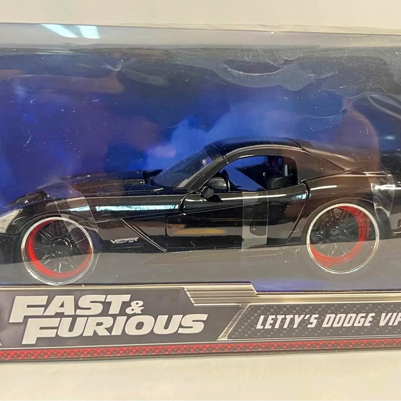 JADA diecast sports car, black coupe with red wheel rims, in box