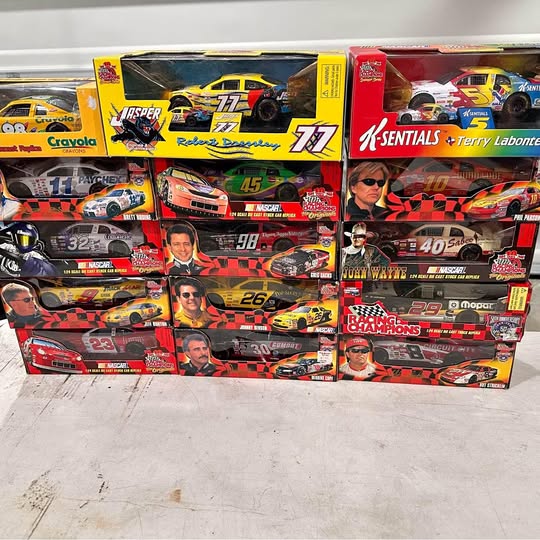 Boxed 1:18 NASCAR diecast cars, multicolor race cars in packaging
