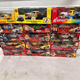 Boxed 1:18 NASCAR diecast cars, multicolor race cars in packaging
