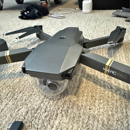 DJI Magic Pro drone, folded arms, front camera lens