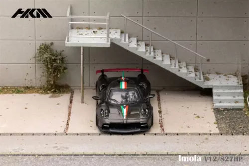 Black 1:64 Pagani Imola V12 diecast model car with carbon-fiber styling, front view