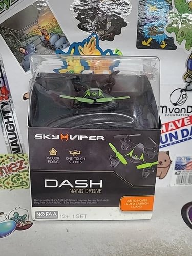 Nano indoor flying dash drone in clear box with green and black design