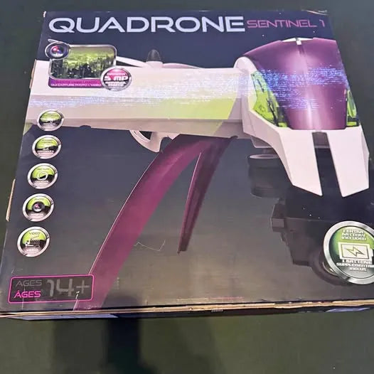 QUADRONE Sentinel V1 drone toy in retail box, purple and white.