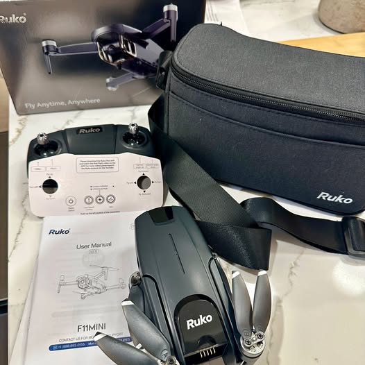 Ruko mini drone with controller, instruction manual, and soft carry case
