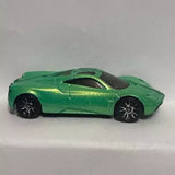 Green Pagani Huayra 2012 diecast sports car with black wheels and hood vents
