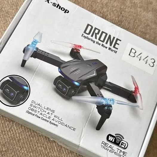 Kids black quadcopter drone with blue LED lights and red accents, foldable prop arms