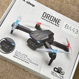 Kids black quadcopter drone with blue LED lights and red accents, foldable prop arms