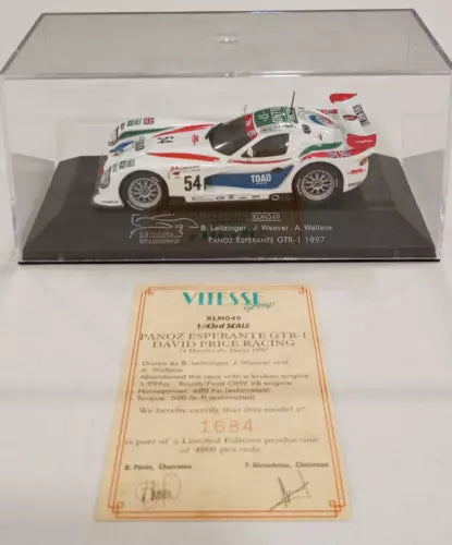 Diecast race car model #54 in clear display case, white with green and red details