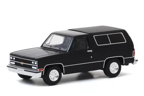 1/64 diecast model SUV, black 1989 Chevy Blazer style, white wheels