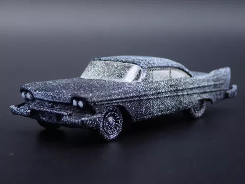 Speckled blue-gray diecast model car, classic 1958 sedan with hood details