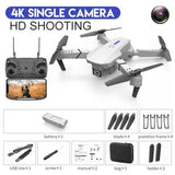 4K camera drone kit with remote, spare blades, battery, USB cable, and storage bag