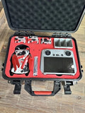 DJI Mini 3 Pro drone kit in red hard case, controller and drone components