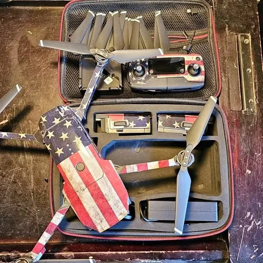 DJI Mavic drone in zip travel case with propellers and controller modules