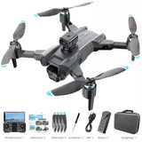 Gray FPV quadcopter drone with 4 propellers and camera, plus remote and accessories