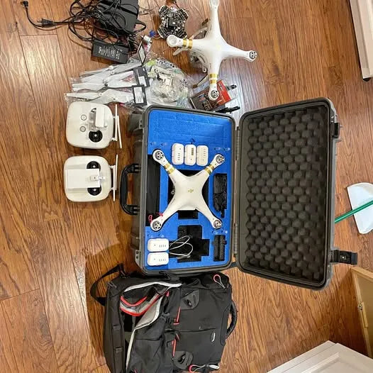 White DJI Phantom 3 Pro drone kit with accessories in protective hard case