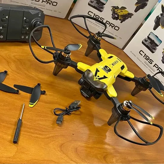 Yellow quadcopter drone with camera and four black propellers