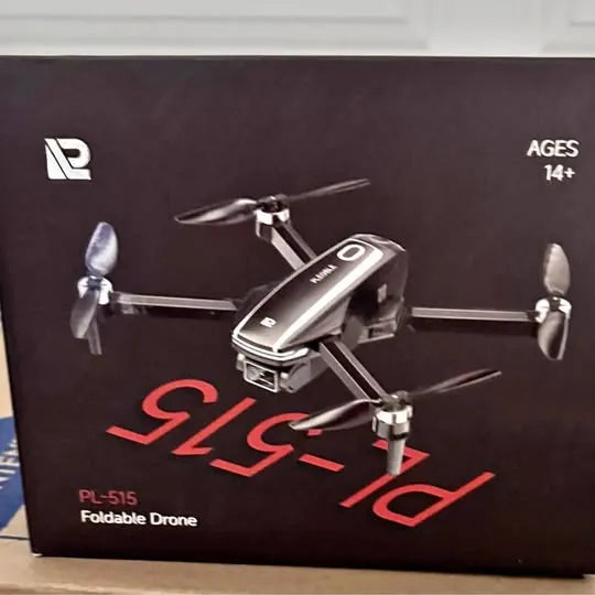 Foldable quadcopter drone with four propellers, dark body and landing legs