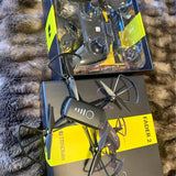 Foldable quadcopter drone with four propellers, black and neon yellow, FADER 2 branding