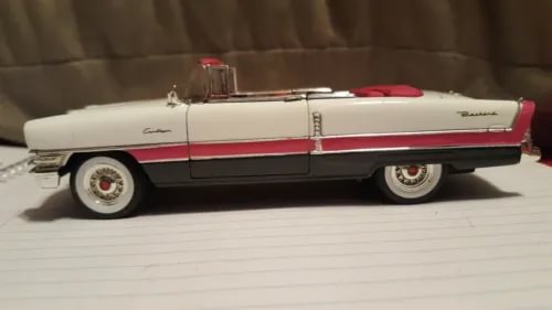 1955 Caribbean diecast model car, white with red stripe, side view