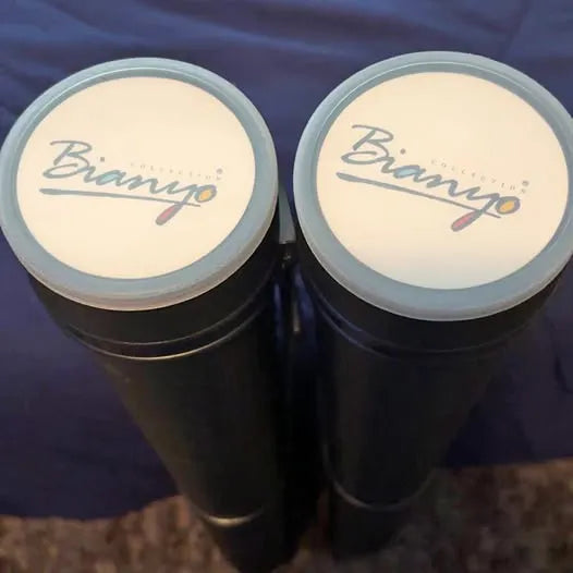 Pair of cylindrical containers with cream round lids and Bianyo logo