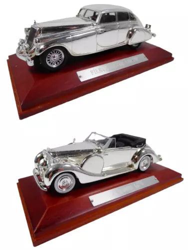 Set of 2 1:43 diecast classic cars, silver and dark, on display bases