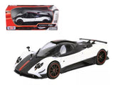 1/18 diecast sports car model in white and black with red wheels