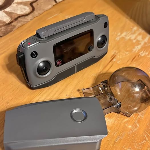 Drone remote controller and battery, gray with joystick and screen