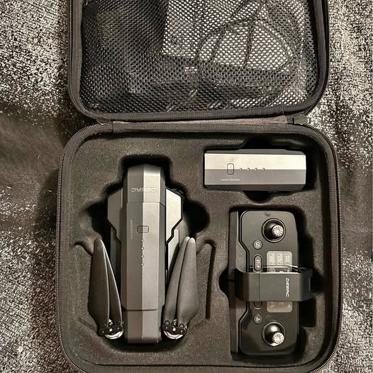 Black rugged case with drone and controller accessories inside