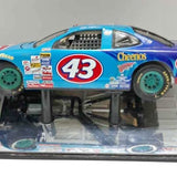 Diecast race car with number 43 on blue and purple body, green wheels