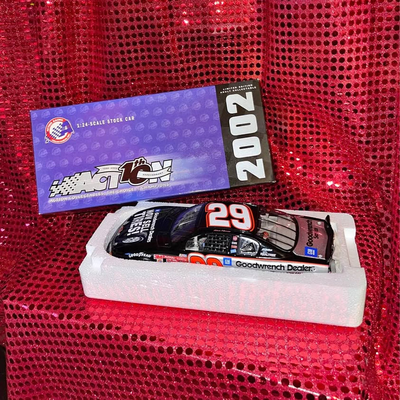 Diecast stock car #29 in white foam tray, blue and black livery