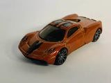 Orange diecast sports car with black hood stripes and multi-spoke wheels